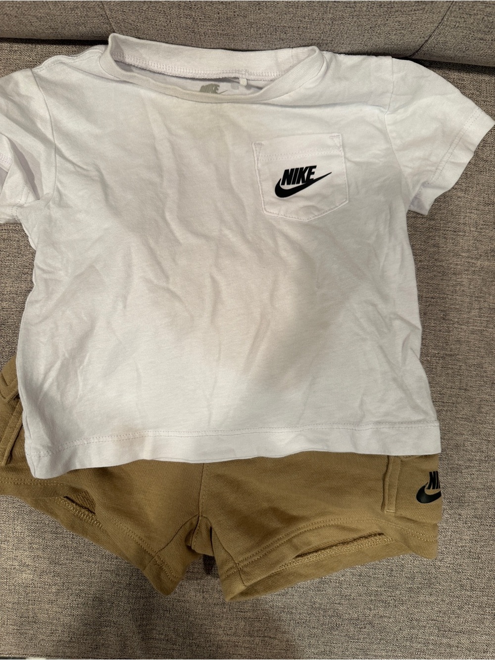 Nike White T-Shirt with Black Swoosh and Subtle Grey Tag Print